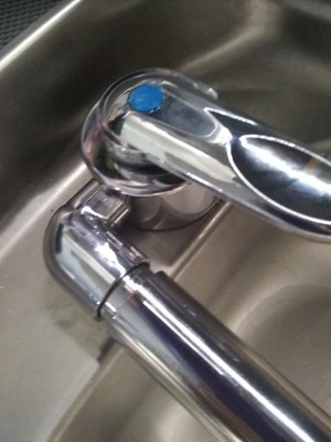 The tap as fitted - water leaked from the outlet, and under the sink